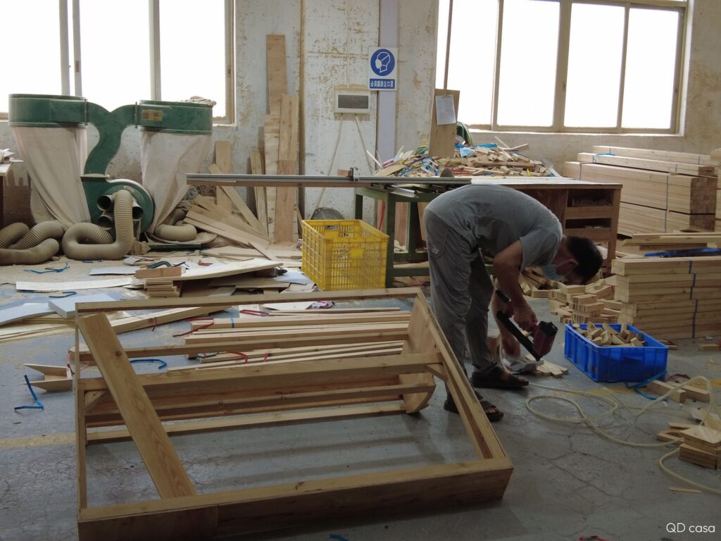 The workers are customizing the wooden frame