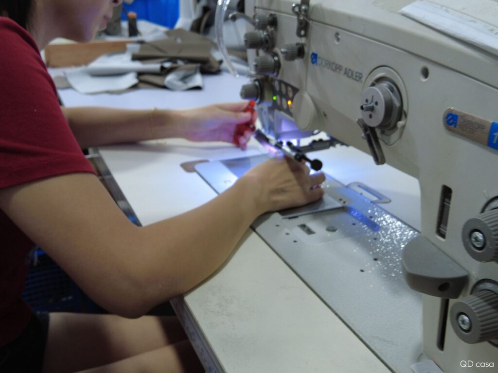 The workers are tailoring the sofa